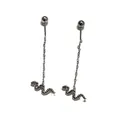 Detail of silver snake drop earrings with long chains and engraved scale texture - Snake Ear Thread / Silver