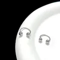 Macro view of bright silver horseshoe piercing rings with spheres on a white ceramic edge - Smooth Round / 4mm (1 Piece) / Silver