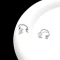 Detailed view of silver U-shaped earrings with square cut zircon on white plate - Square Crystal / 4mm (1 Piece) / Silver