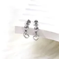 Close-up of silver steel stud earring with ball bead and hollow heart-shaped pendant - Hollow Heart