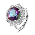 Macro shot of luxury crown ring featuring a large mystic topaz and sparkling white zircons - Adjustable Open / Rainbow Stone