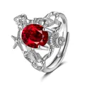 Detail of adjustable silver ocean ring with large red zircon and seashell carvings - Adjustable Open / Ruby Red