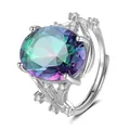 Macro detail of oval cut rainbow sapphire on silver tree branch textured ring band - Branch Texture Style / Rainbow Stone