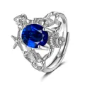 Macro detail of silver ocean-themed ring with starfishes and blue oval gemstone - Adjustable Open / Sapphire Blue