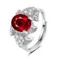 Detail view of oval ruby red gemstone ring with clear zircon crystals and adjustable band - Rose Shape (QHJ010) / Ruby Red