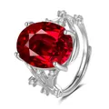 Macro detail of leaf-shaped silver ring featuring a large oval red gemstone centerpiece - Branch Texture Style / Ruby Red