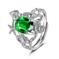 Macro view of ocean-themed ring featuring green main stone with seashell and starfish details - Adjustable Open / Emerald Green