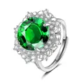 Macro detail of luxury flower ring featuring a large green stone and zircon halo setting - Adjustable Open / Emerald