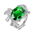 Close-up of emerald green oval gemstone ring with bamboo texture silver band details - Adjustable Open / Emerald
