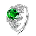 Detail of oval green gemstone and white side diamonds on an adjustable silver ring - Rose Shape (QHJ010) / Emerald Green
