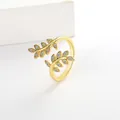 Macro view of gold olive branch open ring featuring sparkling white zircon stones - Adjustable Open / Gold