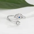 Macro shot of silver evil eye ring featuring blue stone and white zircon details - Adjustable Open / Silver
