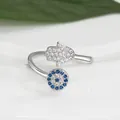 Macro detail of Evil Eye and Hand of Fatima ring with blue and clear zircon stones - Adjustable Open / Silver