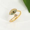 Detailed view of the gold Evil Eye open ring featuring vibrant blue and white crystals - Eye Open Adjustable / Gold
