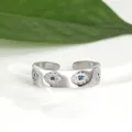 Detail of silver Evil Eye open ring with blue stones and sparkling cubic zirconia - Adjustable Open / Silver