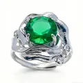 Silver flower ring with large round emerald green stone and sparkling white side accents - Emerald Style / Emerald