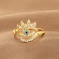 Detailed view of evil eye ring with blue stone and pavé cubic zirconia in gold plating - Evil Eye Crown Shape (Q-J087) / Gold