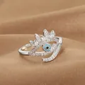 Macro shot of silver evil eye crown ring with blue stone and cubic zirconia inlay - Evil Eye Crown Shape (Q-J087) / White Gold