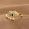 Detail shot of a gold-plated evil eye ring with blue and white pavé cubic zirconia - Pave Evil Eye Style (Q-J073) / Gold