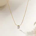 Pear shape drop crystal necklace in 18K gold plated stainless steel on a white background - O-chain Water Drop Gold (XKN0176)