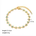 Detail of gold daisy bracelet with blue enamel inlay and stainless steel lobster clasp - Blue Flower Bracelet