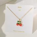 Chic strawberry pendant necklace with red enamel and gold chain on a white display card - Two Strawberries Style (XKN8283) / Gold