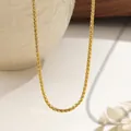 Minimalist gold snake chain necklace for women displayed on an elegant textured surface - 3mm / Gold / Necklace
