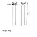 Silver bow tassel earrings detail with 10cm drop length and 2.4cm width dimensions - Earrings (XKE0280) / Steel