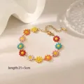 Detailed macro view of colorful daisy anklet with gold plating and adjustable length clasp - Colorful Daisy Bracelet / Gold