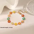 Detailed macro view of colorful daisy anklet with gold plating and adjustable length clasp - Colorful Daisy Bracelet / Gold