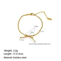Detail of golden stainless steel bow bracelet featuring flat snake chain and lobster clasp - Bracelet (XKB0099) / Gold
