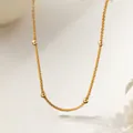 Detail of gold plated stainless steel star chain with polished beads on white background - Necklace / Gold