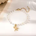 Detailed shot of pearl bracelet with gold starfish pendant and adjustable lobster clasp - Pearl Starfish Bracelet / Gold