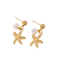 Detail of gold starfish earrings with white round pearls on a clean white background - Pearl Starfish Earrings / Gold