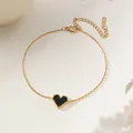 Elegant gold titanium steel bracelet featuring a vintage black heart pendant with beaded edges - Black Shell Heart Bracelet (XKB0041)