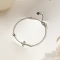 Elegant 18K silver-finished stainless steel cross bracelet with a small zircon stone - Steel Cross Bracelet (XKB0267)
