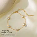 Gold stainless steel bracelet with five round marble pearls and 17+5cm extender chain - Pearls Bracelet / Gold