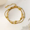 Layered gold snake chain necklace with smooth oval beads in a minimalist luxury style - Oval Bead Snake Chain Bracelet (XKB0070) / Gold