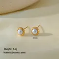 Minimalist stainless steel pearl stud earrings with a gold rimmed bezel design - Single Pearl Earrings / Gold