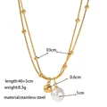 Double-layer stainless steel necklace with gold beads and a white pearl pendant - Double Layer Pearl Necklace / Gold