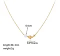 Detail of 40+5cm gold titanium necklace featuring dolphin charm and small white pearl - Pearl Dolphin Necklace / Gold