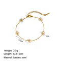 Detail view of a 17.5+5cm gold stainless steel bracelet with five pearl flower charms - Five White Flowers (XKB2213)