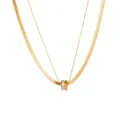 Dettaglio della collana dorata a due strati con catena a serpente e ciondolo in zircone - Stile Oro a Doppio Strato / Oro