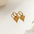 Polished gold heart drop earrings with round clasp on a minimalist aesthetic background - Pointy Heart Hoop Earrings (XKE0253) / Gold