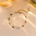 Goldenes Edelstahl-Perlenarmband mit bunten Edelsteinen und S.STEEL-Anhänger - Buntes Perlenarmband (XKB0240) / Gold