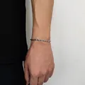 Close-up of a silver twist rope chain bracelet with detailed braided metal craftsmanship - Width 4mm-Length 22.86cm / Steel