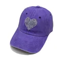 Close-up of washed purple cotton baseball cap featuring a sparkling rhinestone heart - Purple