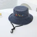 Close-up of kids navy denim bucket hat with embroidered vehicle patterns and wind cord - 54cm / Navy Blue