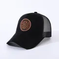Detail of black mesh baseball cap with suede front and Enjoy Life circular leather patch - Adjustable / Black