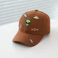 Detail of space embroidery featuring aliens and spaceships on a brown kids baseball cap - Small/Adjustable / Coffee